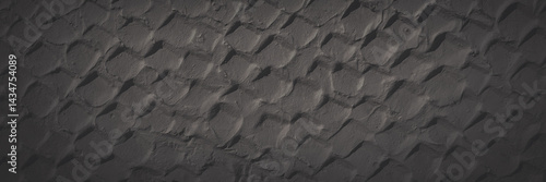 Obraz na płótnie The texture of the plastered wall. Rough corrugated cement surface. Uneven angular pattern. Faded dark wide panoramic background for design. Shaded vintage texture with vignette. w salonie