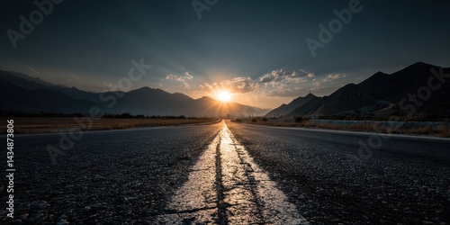 Abstract road winding toward sunrise on a distant mountain horizon, symbolizing vision, success, and motivation in life and career paths.