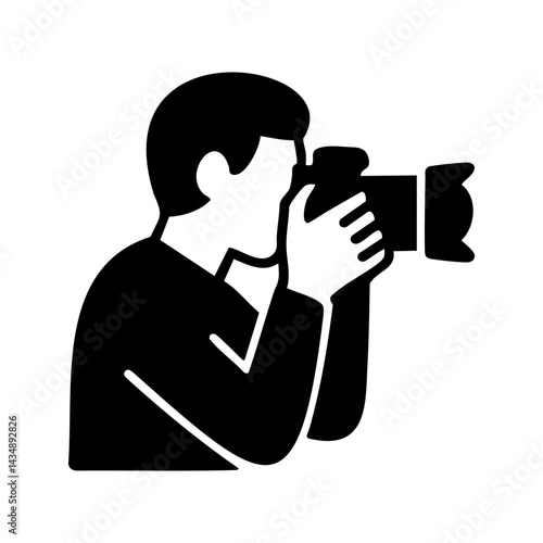 Black and white icon showing a professional photographer capturing an image with a DSLR camera, symbolizing creative photography work.