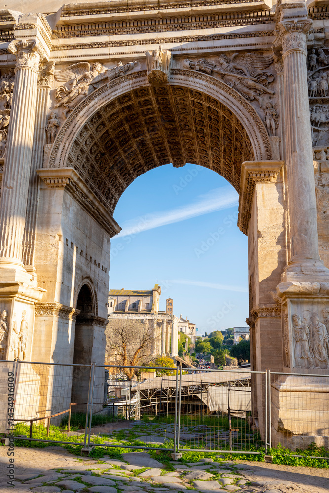 Fototapeta premium The Arch of Septimius Severus at the northwestern end of the Roman Forum is a white marble triumphal arch dedicated in 203 AD to commemorate the Parthian victories of Emperor Septimius Severus and his