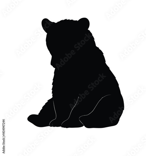 Bear cub sitting silhouette. This image shows a black silhouette of a young bear cub sitting peacefully, with detailed outlines of its ears, paws, and fur. Vector clipart illustration design.