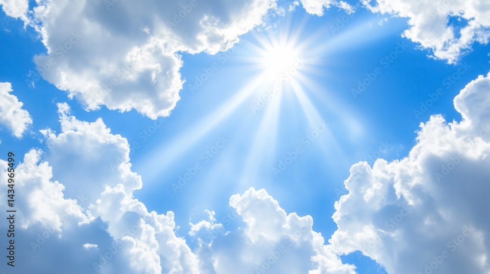 Bright sunbeams pierce fluffy clouds against a vibrant blue sky