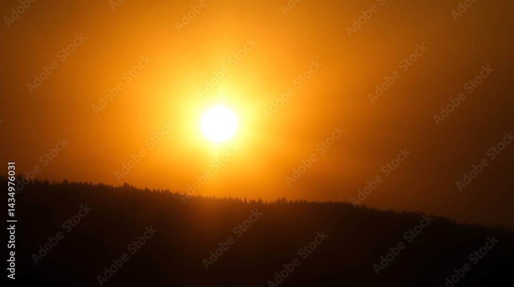 Fototapeta premium Golden Sunset over Silhouetted Hills