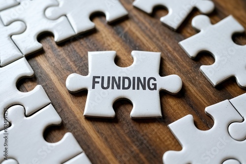 puzzle piece with funding word. Lacking budget problem
