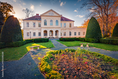 Obraz na płótnie Spectacular autumn view of Ernuszt castle. Wonderful sunset in Hungary, Europe. Gorgeous evening cityscape of Ernuszt town, Europe. Trees covered with orange and crimson leaves. w salonie