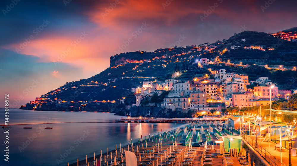 Fantastic summer cityscape of Minori town. Dramatic sunset on Mediterranean resort. Astonishing evening scene of Italian coast of Mediterranean sea, Salerno region. Vacation concept background.