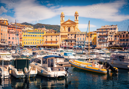 Φωτογραφία Bright summer cityscape of Bastia port with twin-towered Church of St