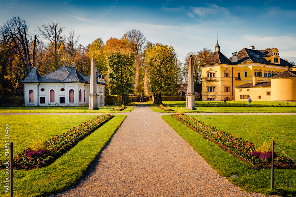 Attractive autumn view of Hellbrunn castle, Austria, Europe. Spectacular morning cityscape of Morzg, district of Salzburg city, Austria, Europe. Traveling concept background.