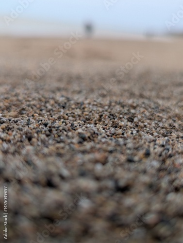 Depth Effect Beach Scene with Sand and Blur Ocean and People