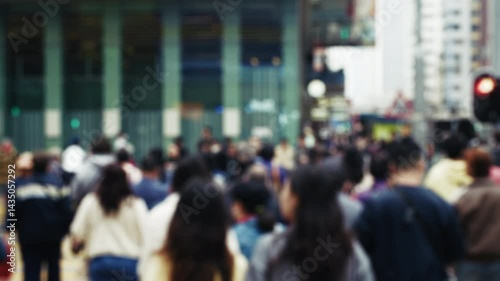 Wallpaper Mural bustling crosswalk in Hong Kong filled with diverse pedestrians. The scene shows blurry figures crossing a multi-lane road against a backdrop of urban architecture Torontodigital.ca