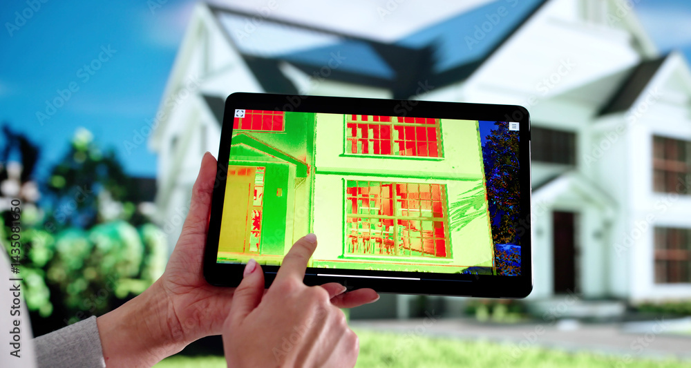 Female Contractor Using Heat Imaging