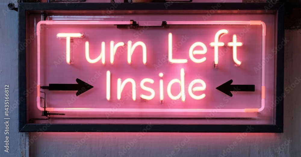 Obraz premium Bright pink neon sign displays directions. Text reads Turn Left Inside with arrows indicating entry point. Simple, direct messaging.