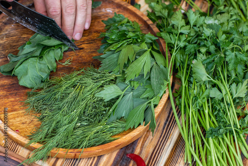 Obraz na płótnie fresh greens from the garden, prepared for summer salad in the country. w salonie