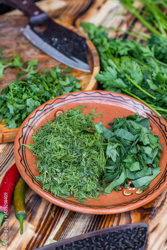 Obraz na płótnie fresh greens from the garden, prepared for summer salad in the country. w salonie
