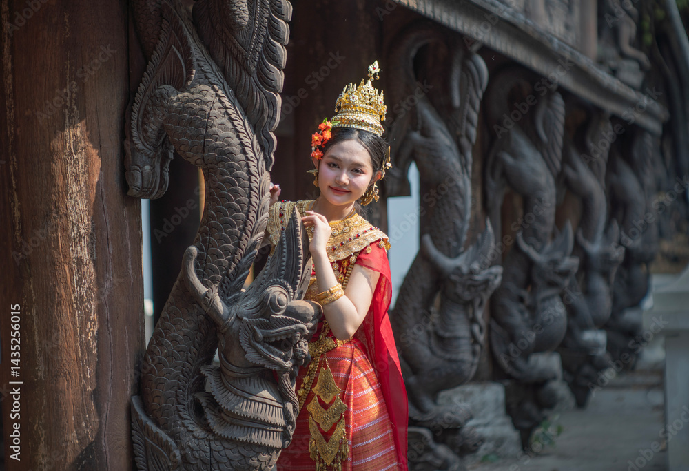 Beautiful young woman wearing Thai Songkran costume, a regional Thai costume dress in Chiang Mai, Thailand.