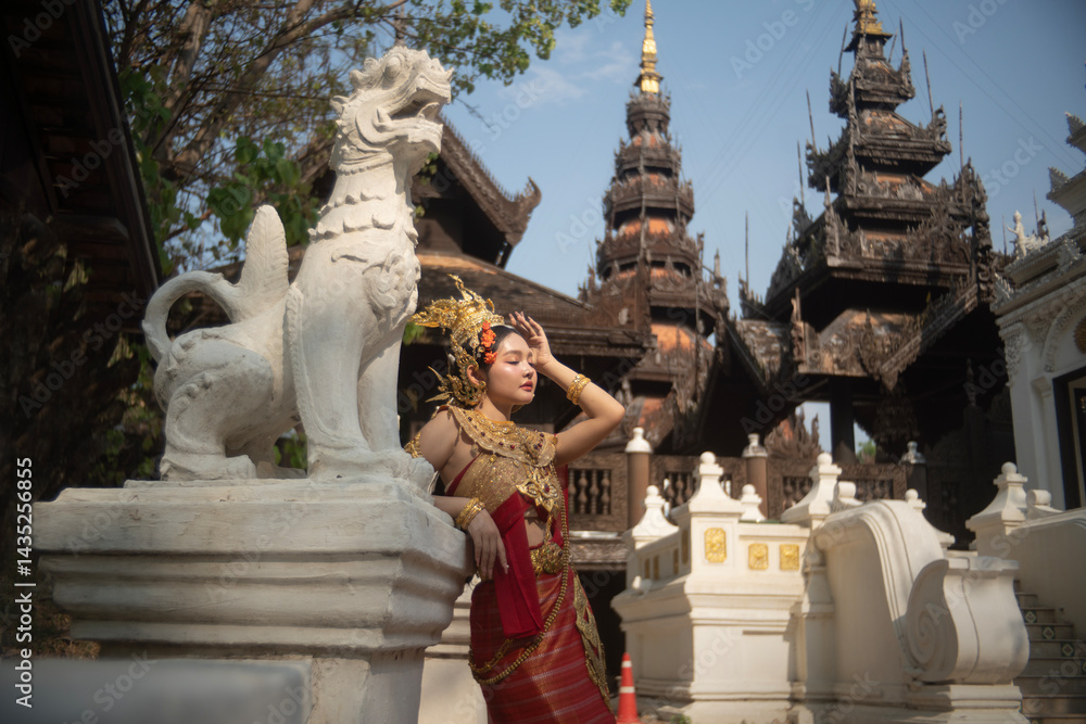 Beautiful young woman wearing Thai Songkran costume, a regional Thai costume dress in Chiang Mai, Thailand.