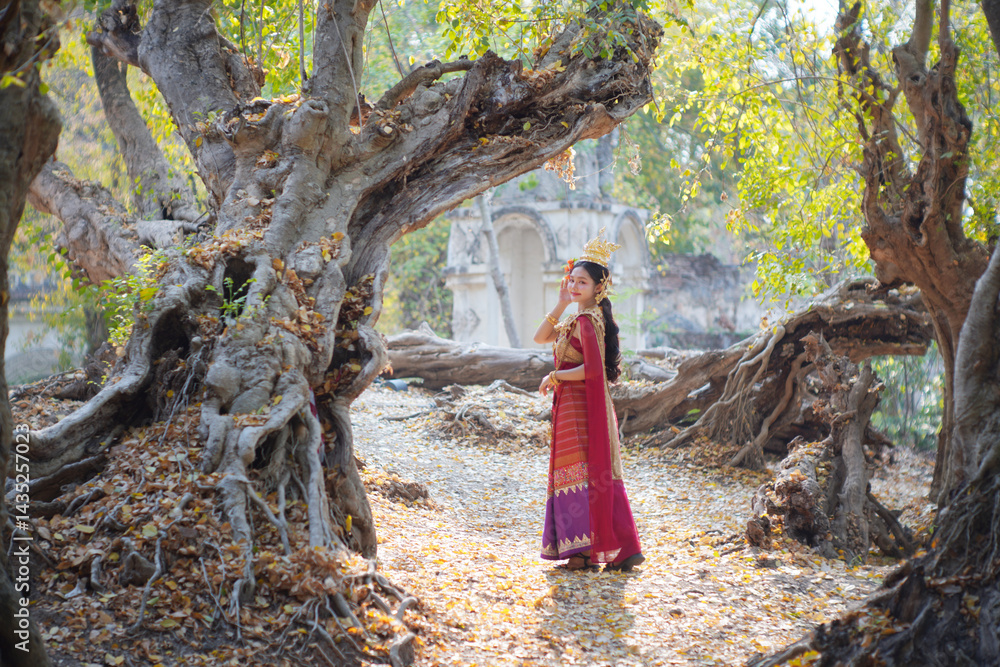 Beautiful young woman wearing Thai Songkran costume, a regional Thai costume dress in Chiang Mai, Thailand.