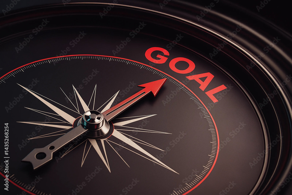 Compass needle pointing to the word GOAL on a dark metallic compass face, symbolizing direction and goal setting Compass needle pointing to the word GOAL on a dark metallic compass face, symbolizing direction and goal setting