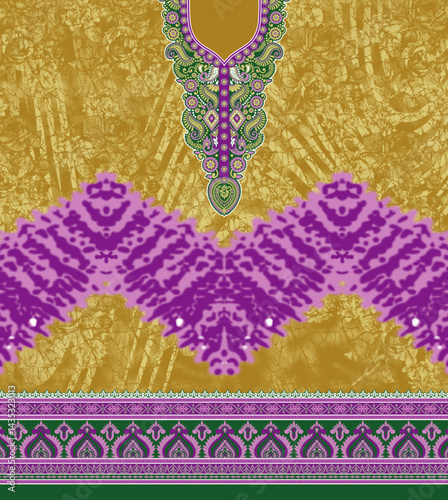 Elegant textile design featuring a golden background, ornate green and purple motifs, and intricate border patterns.