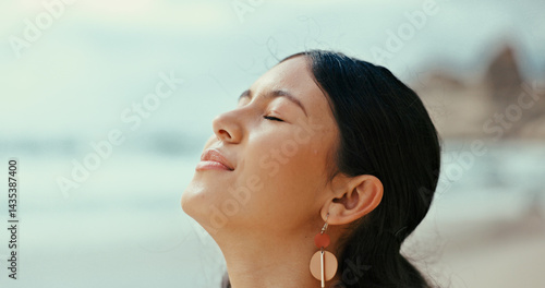 Billede på lærred Happy woman, relief and relax with fresh air at beach for peace, tranquility or natural meditation