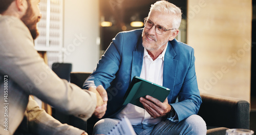 фотографія Business people, mature or CEO shaking hands for negotiation, agreement or b2b deal in lobby