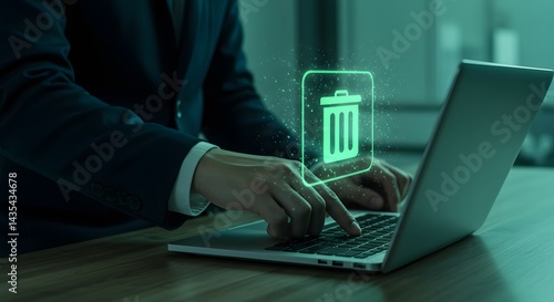 Data Deletion: Business Professional Erasing Files on Laptop, Green Hologram Trash Icon.