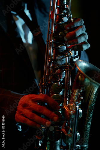 Canvas Print Vertical close up on fingers of skillful saxophonist performing jazz music durin