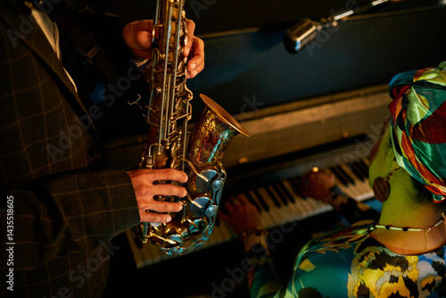 Photography Cropped shot of multiracial musicians improvising on saxophone and piano during