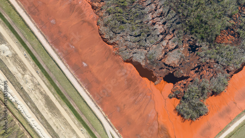 Red mud, bauxite residue, is an industrial waste generated during the processing of bauxite into alumina using the Bayer process.various oxide compounds, including the iron oxides which give its red