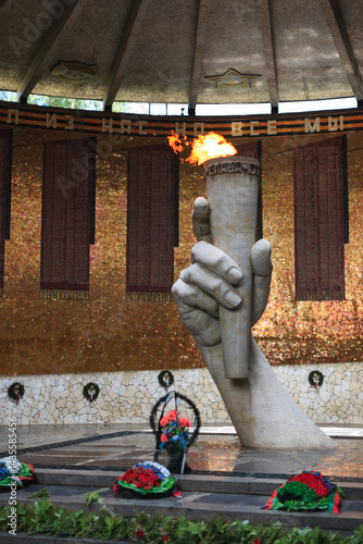 Hall of Military Glory or Pantheon of Glory with hand holding Eternal Flame torch of monument 