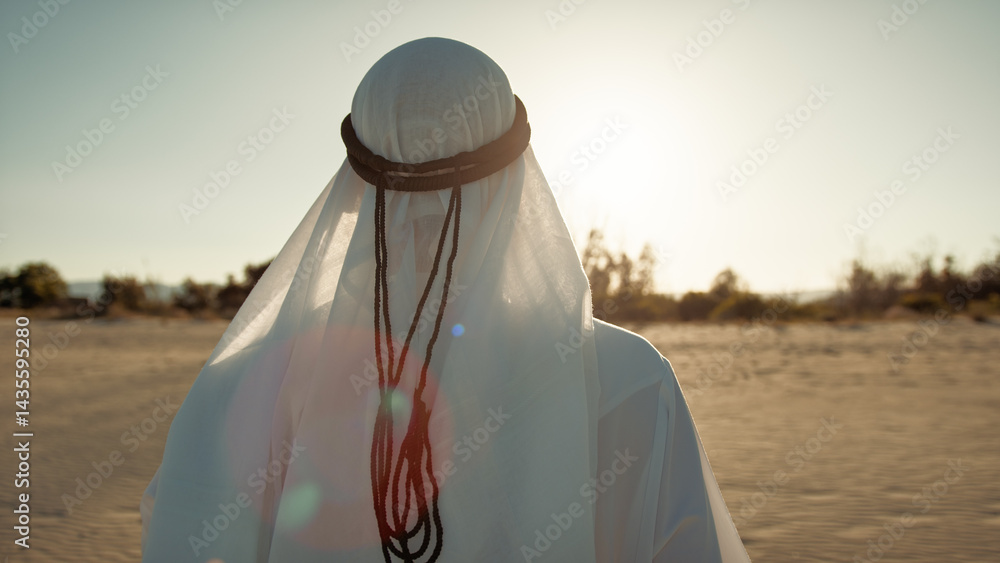 White Dressed Sheik Under The Desert Sunlight