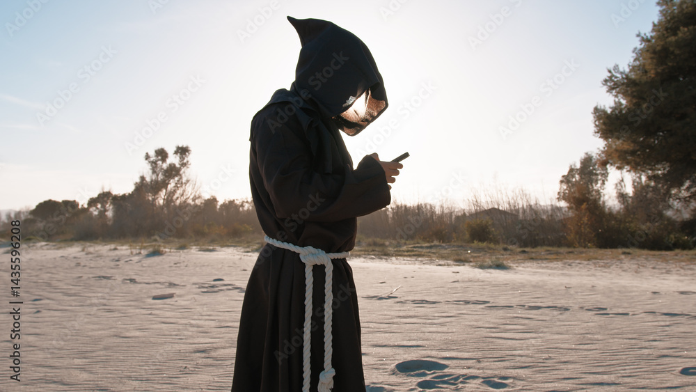 Priest Using The Smartphone At The Beach