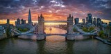 Panoramic, aerial view of the Tower Bridge and skyline of London, United Kingdom, during a beautiful sunset