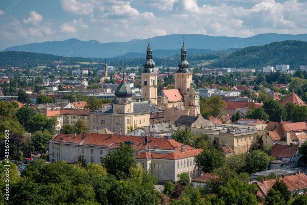 Scenic View of Klagenfurt: A Charming Blend of Beige Architecture and Blue Skies with Clouds, Featuring Landhaus and the Iconic Church Scenic View of Klagenfurt: A Charming Blend of Beige Architecture and Blue Skies with Clouds, Featuring Landhaus and the Iconic Church