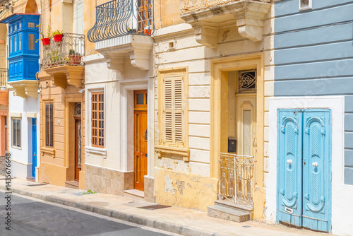 View of a typical Maltese street with old residential buildings in traditional architectural style, Malta