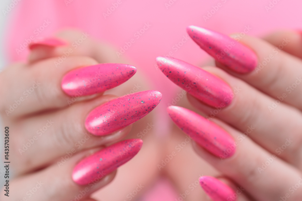 beautiful female hands with long nails and bright neon pink red nail polish beautiful female hands with long nails and bright neon pink red nail polish