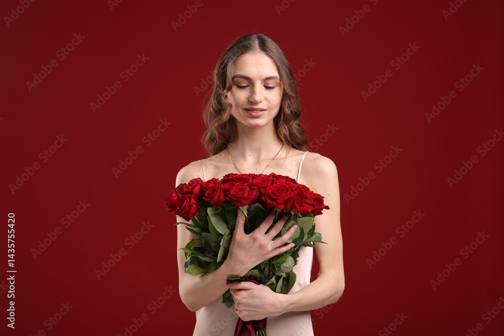 Smiling woman with bouquet of roses on dark red background Smiling woman with bouquet of roses on dark red background