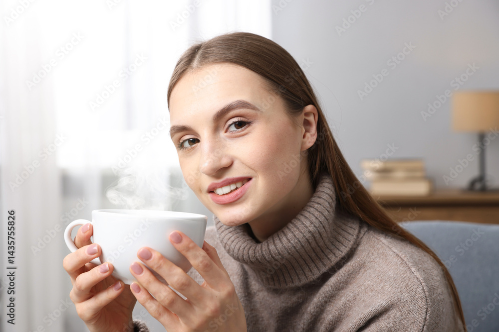 Smiling woman with cup of coffee at home Smiling woman with cup of coffee at home