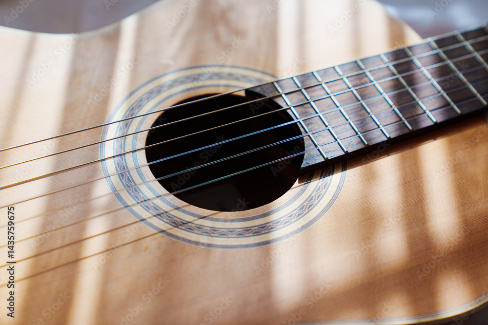Obraz premium rays of light on the guitar.