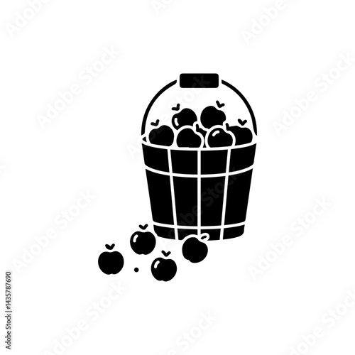 Wooden Bucket Filled with Fresh Apples, Some Fallen on Ground