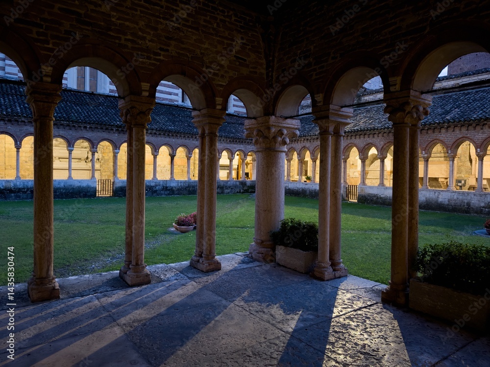 Courtyard with patio and columns in Basilica di San Zeno Maggiore in Verona at night