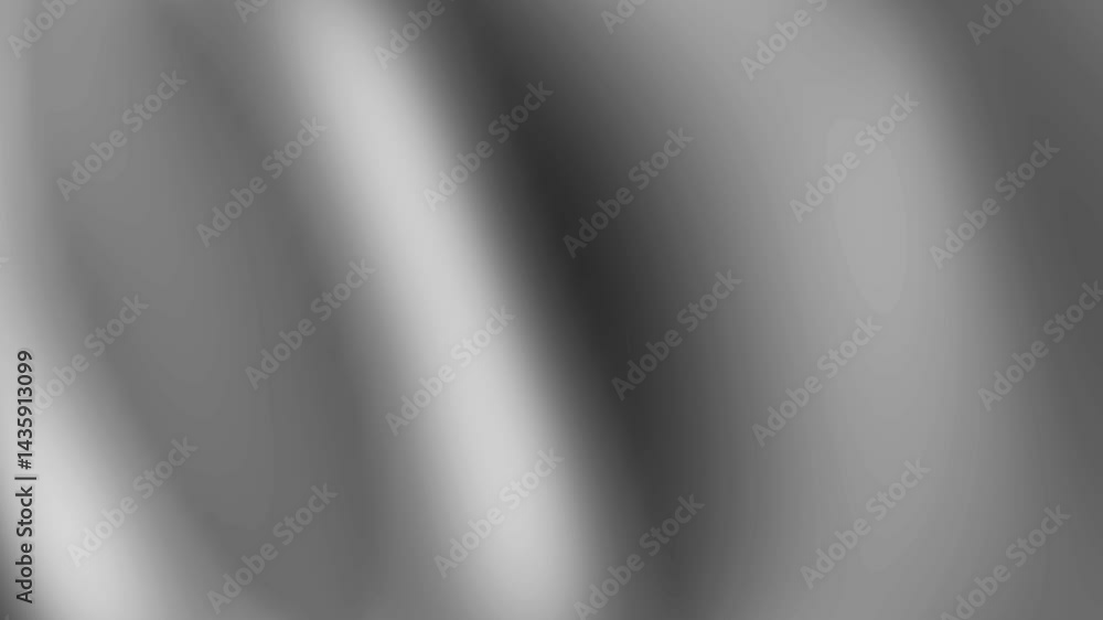 Shiny silver metallic silk fabric with a soft wavy texture creates an elegant backdrop Shiny silver metallic silk fabric with a soft wavy texture creates an elegant backdrop