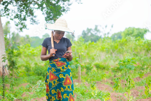 female african farmer using her phone