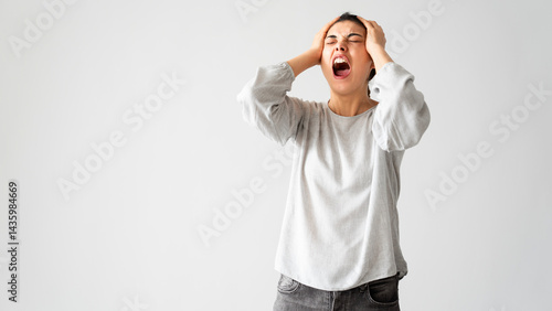 Angry young woman screaming