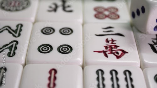 Close-up of Mahjong tile set,Mahjong is a tile-based game from 19th-century China that has gained global popularity since the early 20th century,4k,slow-motion,truck camera movements