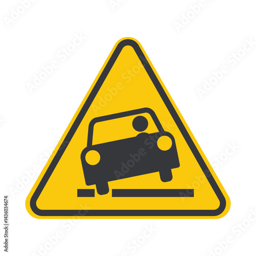 Isolated yellow caution triangle on roadside warns drivers to stay clear of the edge—ditch or trench hazard near rural road