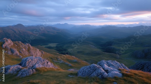 Majestic mountain vista at dawn.  Misty valley stretches between rugged peaks