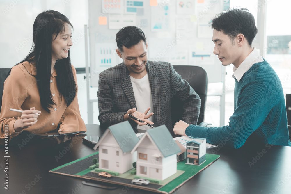 Business team signing investment agreement for residential real estate. Group of professionals in suits meeting in office with financial agreement documents on table.