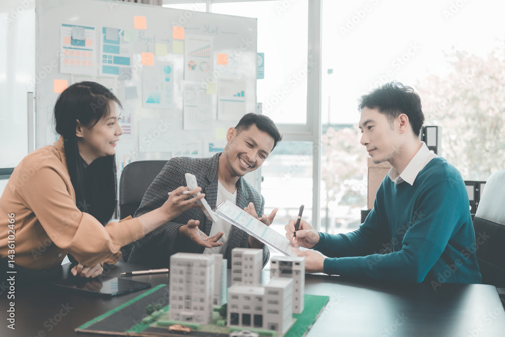 Business team signing investment agreement for residential real estate. Group of professionals in suits meeting in office with financial agreement documents on table.