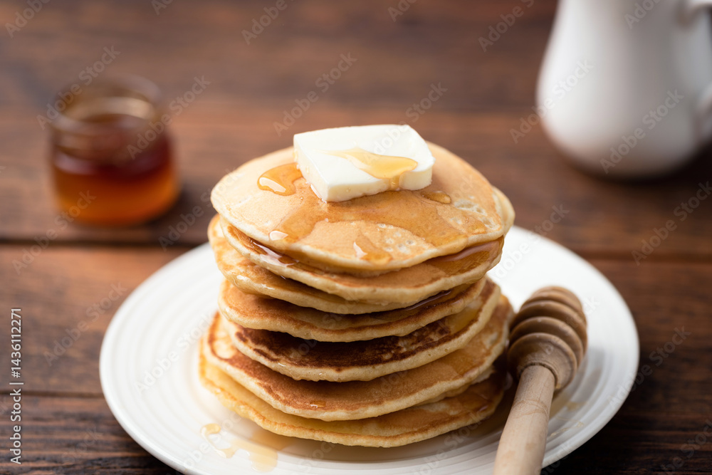 Stack of pancakes with butter and maple syrup Stack of pancakes with butter and maple syrup